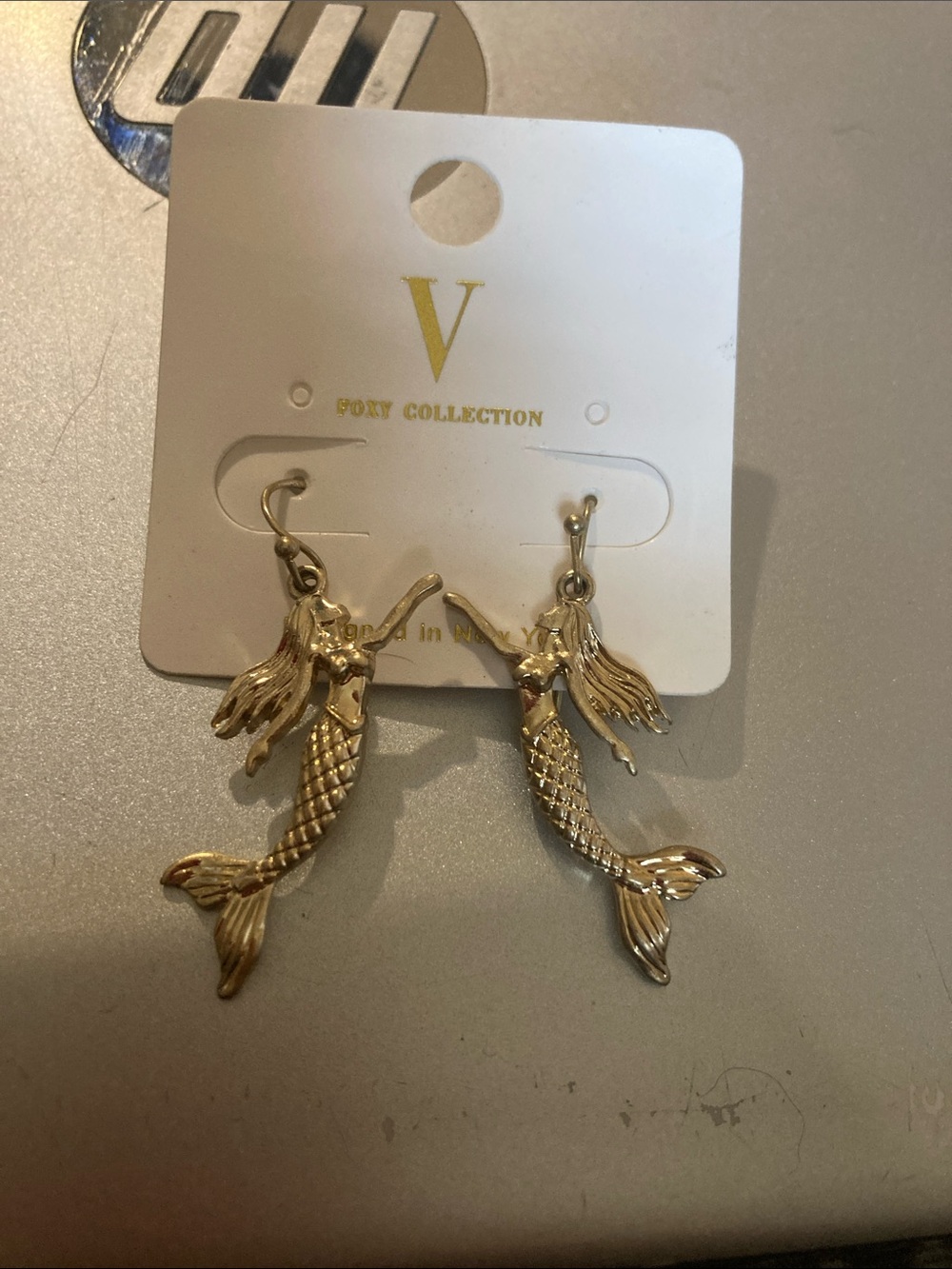 Gold toned mermaid earrings